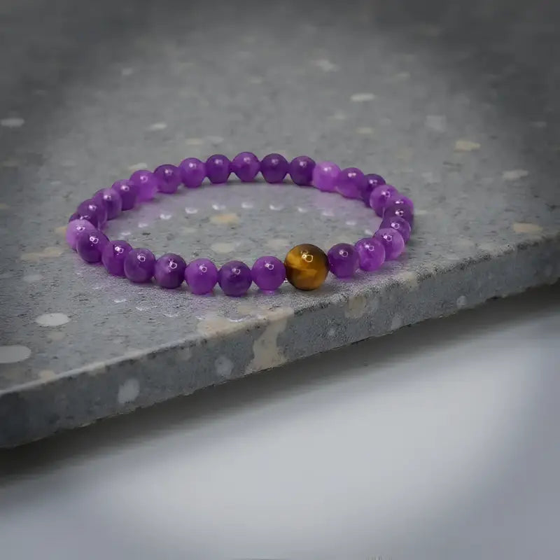 Purple beaded Amethyst Stretch Bracelet with tiger’s eye accent from Bec Sue Jewelry