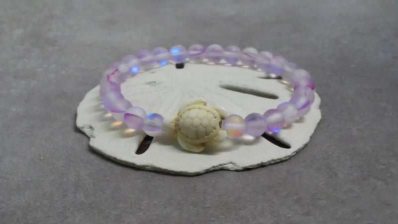 Iridescent beaded bracelet with turtle charm, perfect for beads and decor accessories