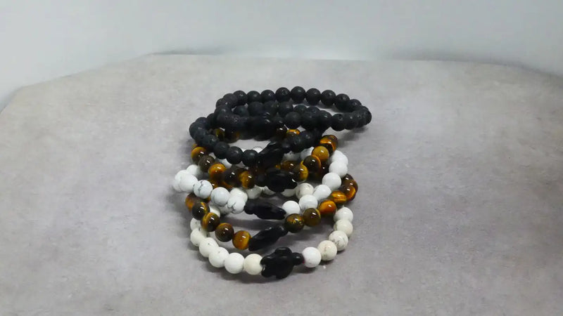 Stack of beaded bracelets with crosses, perfect for unique beads and decor accessories