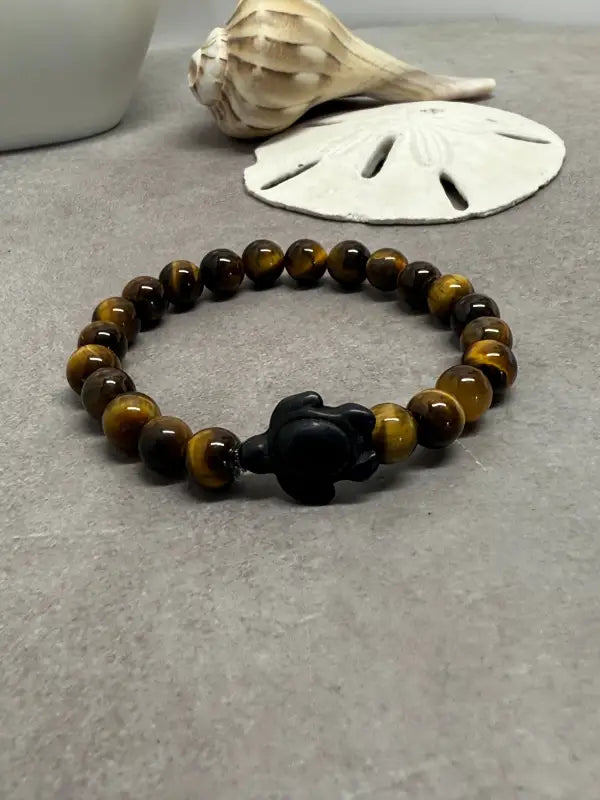 Tiger’s eye beaded bracelet with black turtle charm ideal for unique beads and decor