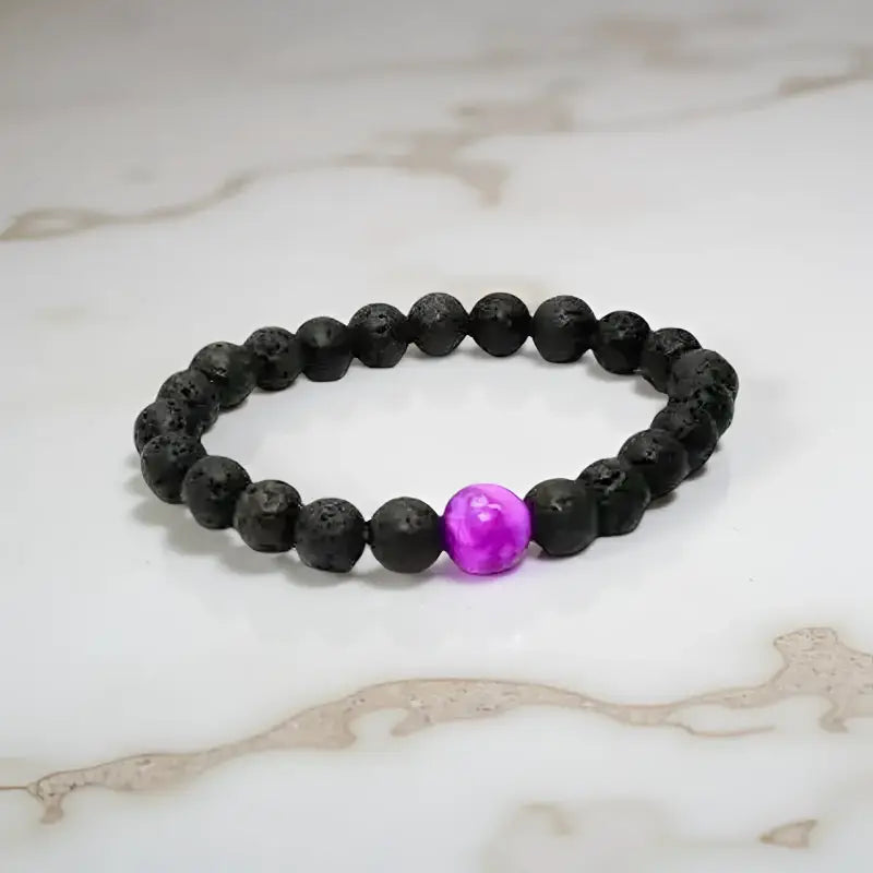 Black lava stone bracelet with purple sugilite accent beads for spiritual fashion