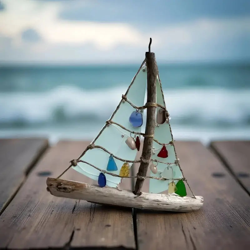 Natural driftwood sea boat jewelry display with glass sails for nautical decor
