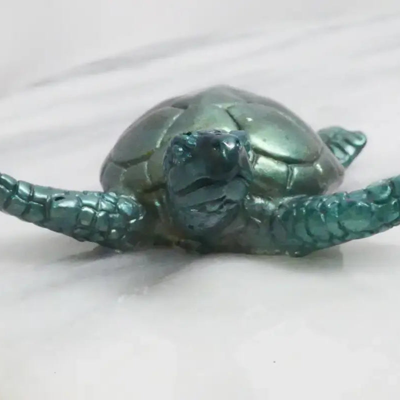 Iridescent green sea turtle figurine ideal for beads, bracelets, and home decor