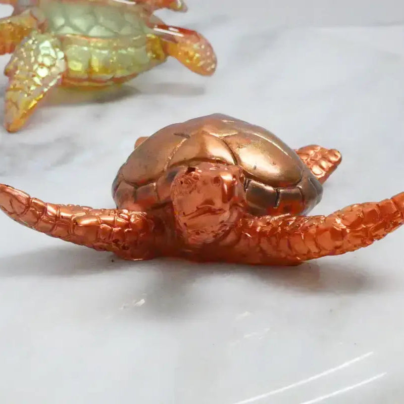 Iridescent turtle figurines perfect for beads, bracelets, and home decor collections