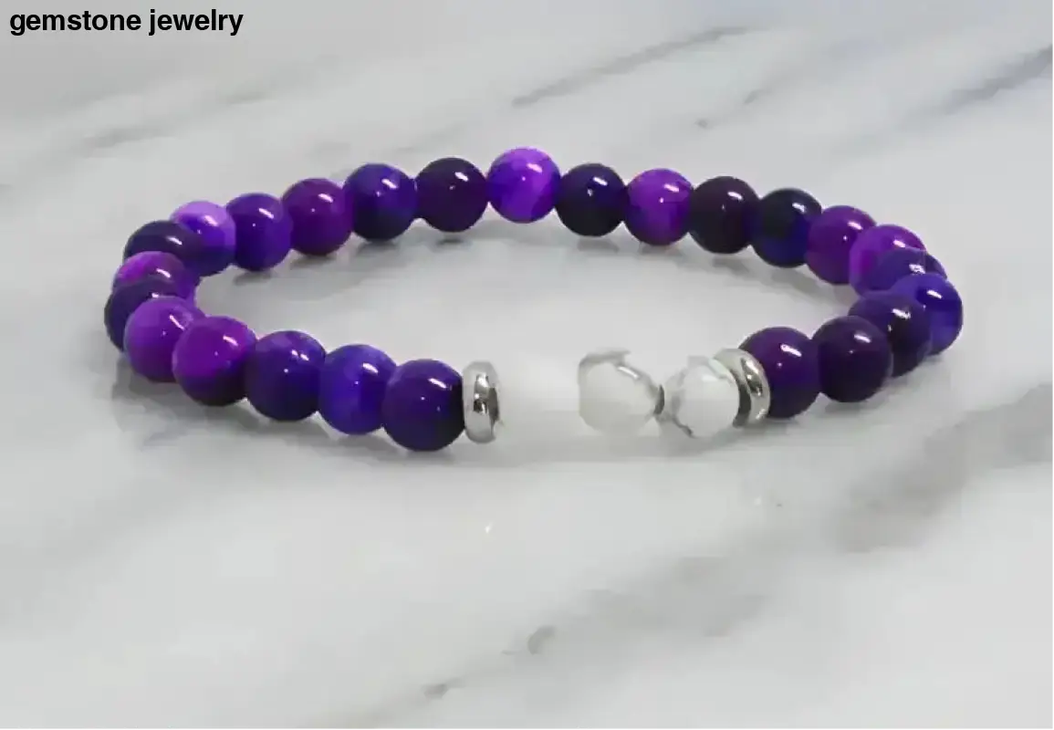 Purple beaded white Howlite stretch bracelet with silver clasp and metallic accents