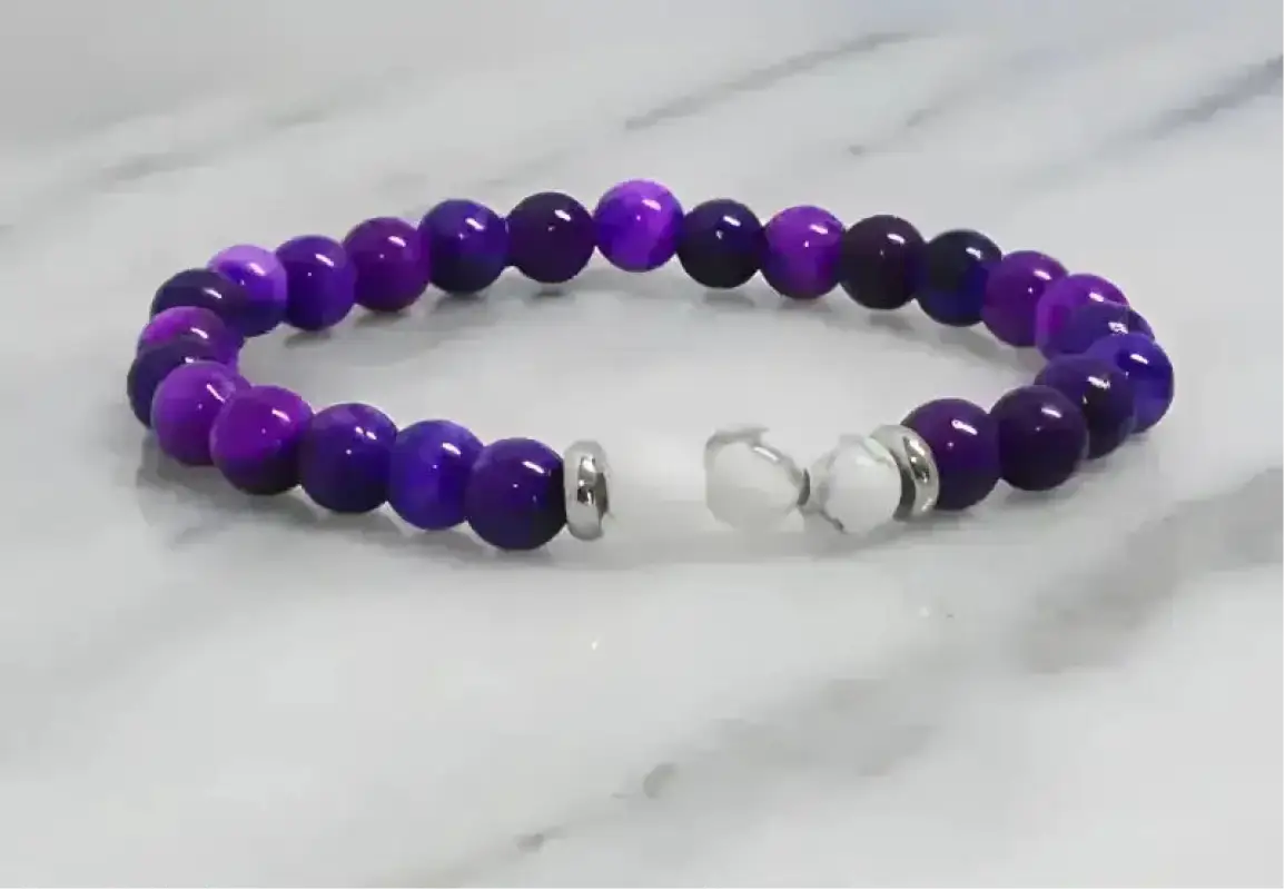Purple beaded white Howlite stretch bracelet with silver clasp and metallic accents