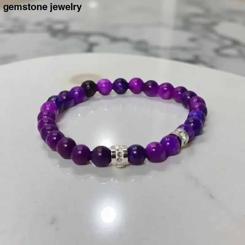 Purple sugilite beaded bracelets with silver accents, featuring 8mm sugilite beads