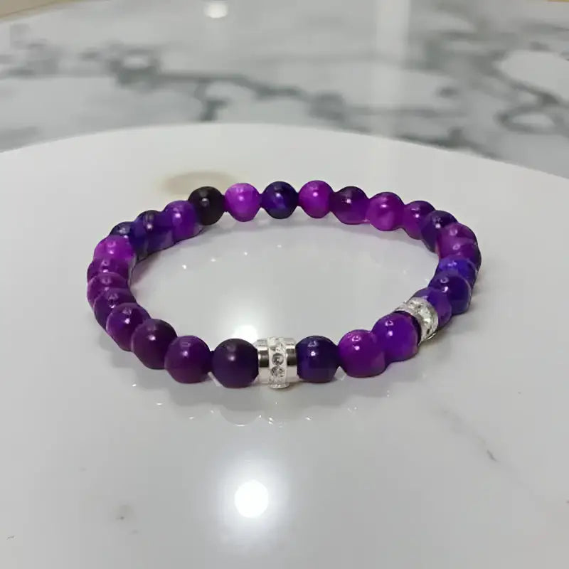 Purple sugilite beaded bracelets with silver accents, featuring 8mm sugilite beads