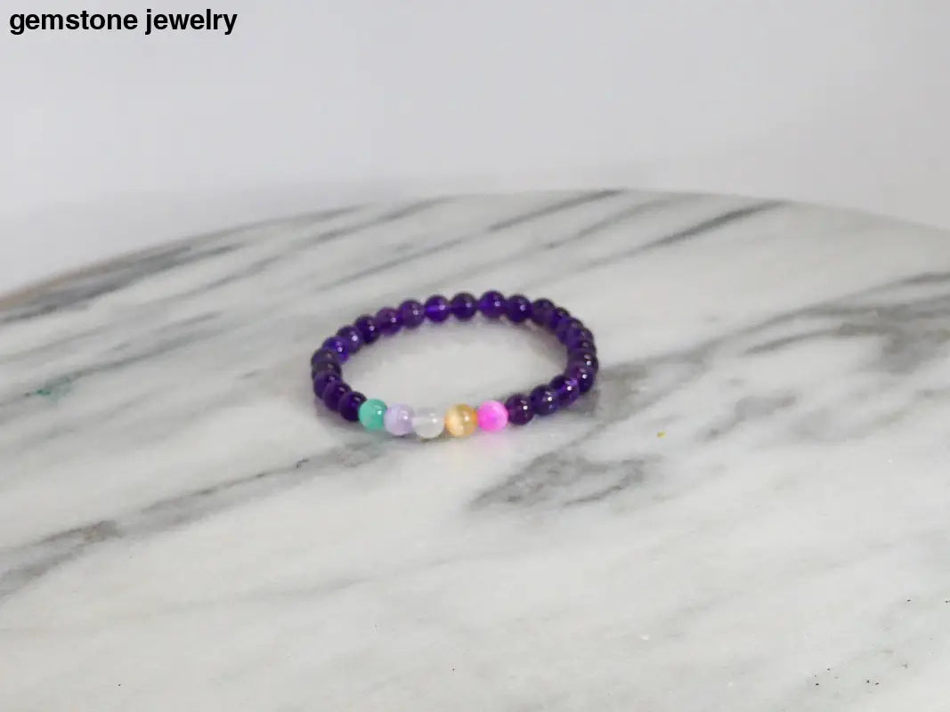 Purple beaded Selenite bracelet with rainbow accents for protective energy
