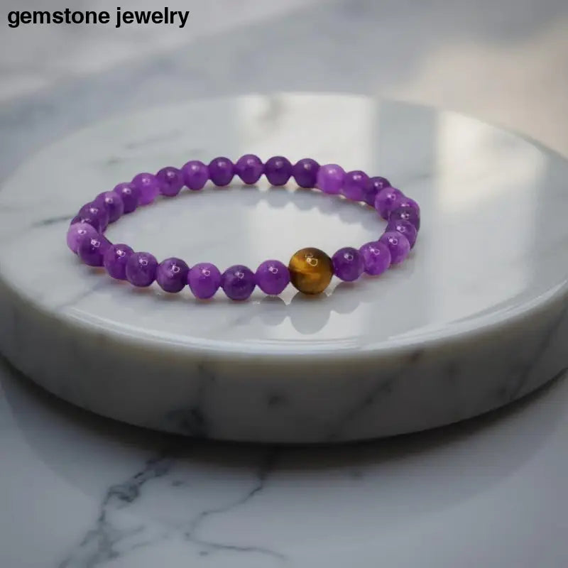 Purple beaded Amethyst Stretch Bracelet with golden accent from Bec Sue Jewelry