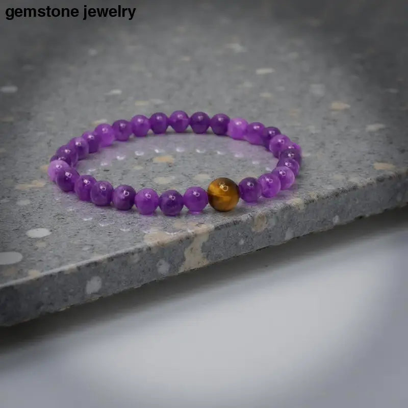 Purple beaded Amethyst Stretch Bracelet with tiger’s eye accent from Bec Sue Jewelry