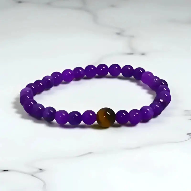 Handcrafted Amethyst Stretch Bracelet with purple beads and a brown accent tiger eye bead