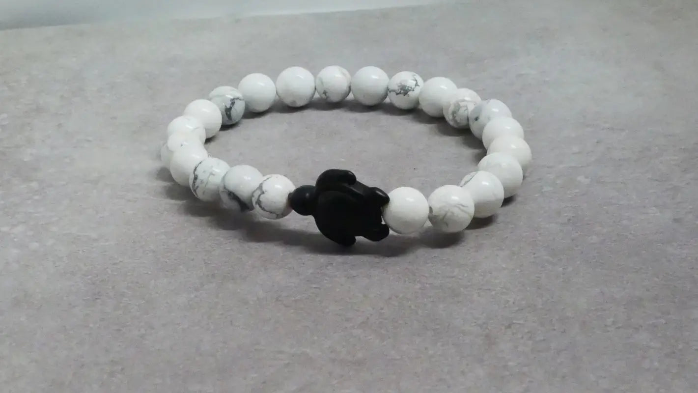 White beaded bracelet with black turtle charm for unique beads and decor accessories
