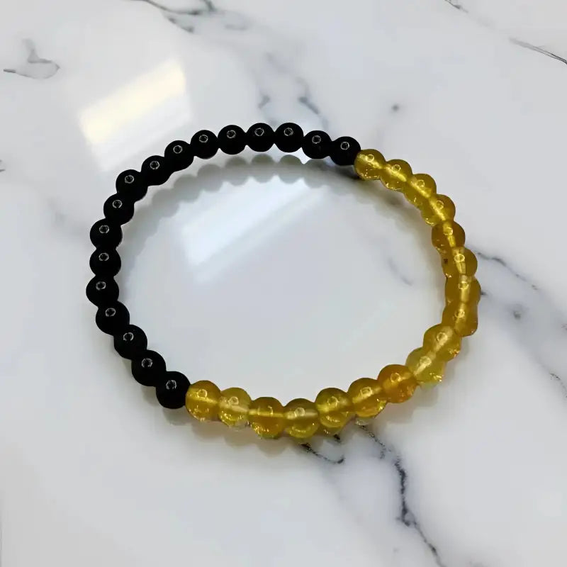 Black and Amber Obsidian Harmony Bracelet with Citrine Accents featuring two-tone beaded design