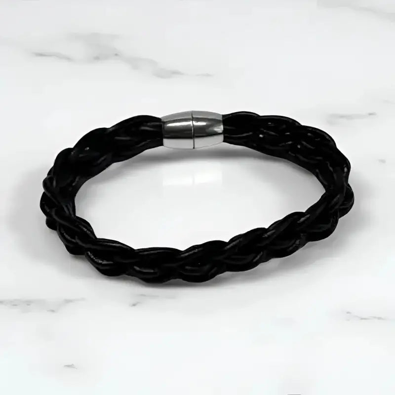 Sleek black leather bracelet with braided design and silver magnetic clasp