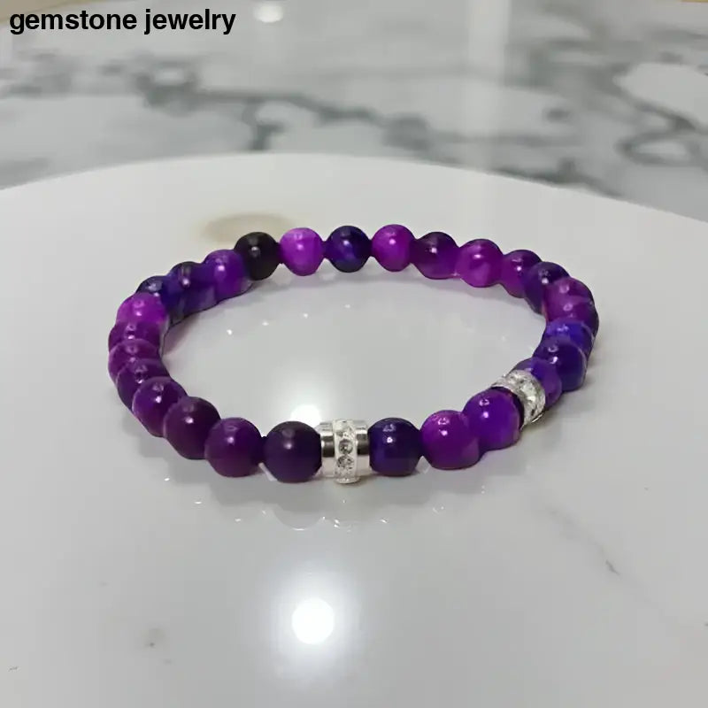 Purple sugilite beaded bracelets with silver accents, featuring 8mm sugilite beads