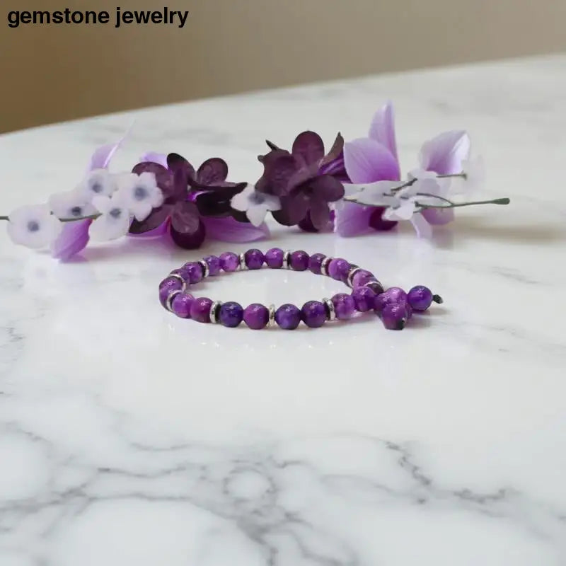 Purple Sugilite Gemstone Bracelet with 8mm round stones in custom gemstone bracelets design