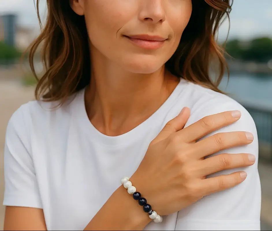 Woman wearing a white t-shirt with a blurred outdoor background