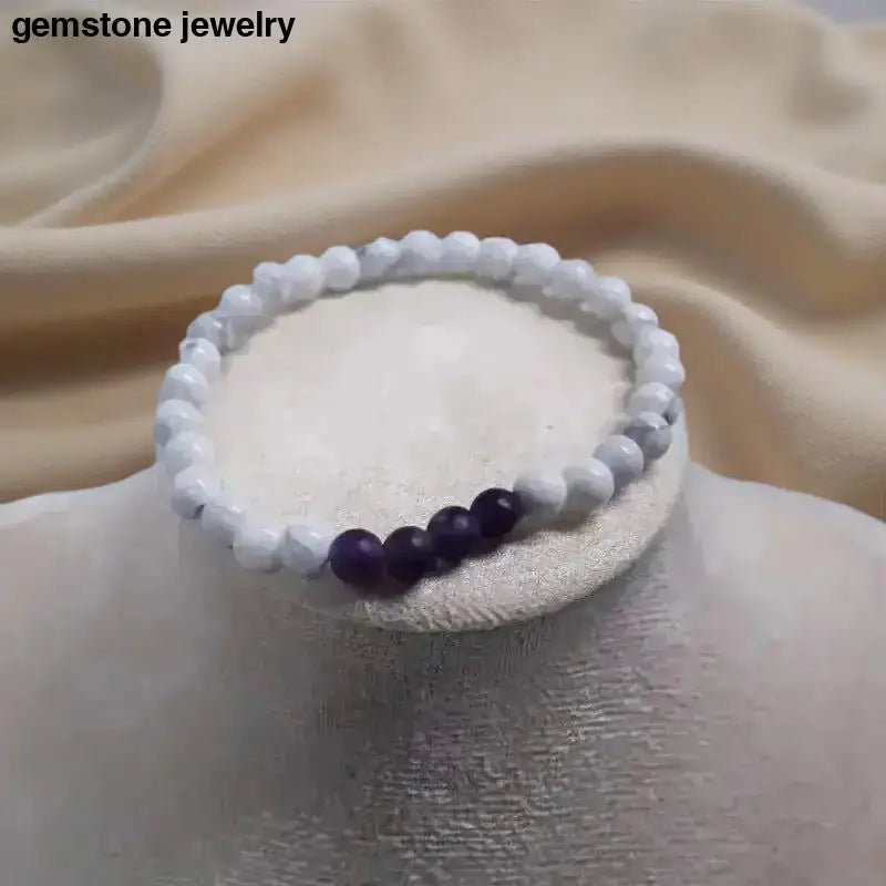 Beaded white howlite bracelet with purple 6mm gemstone beads exuding elegance